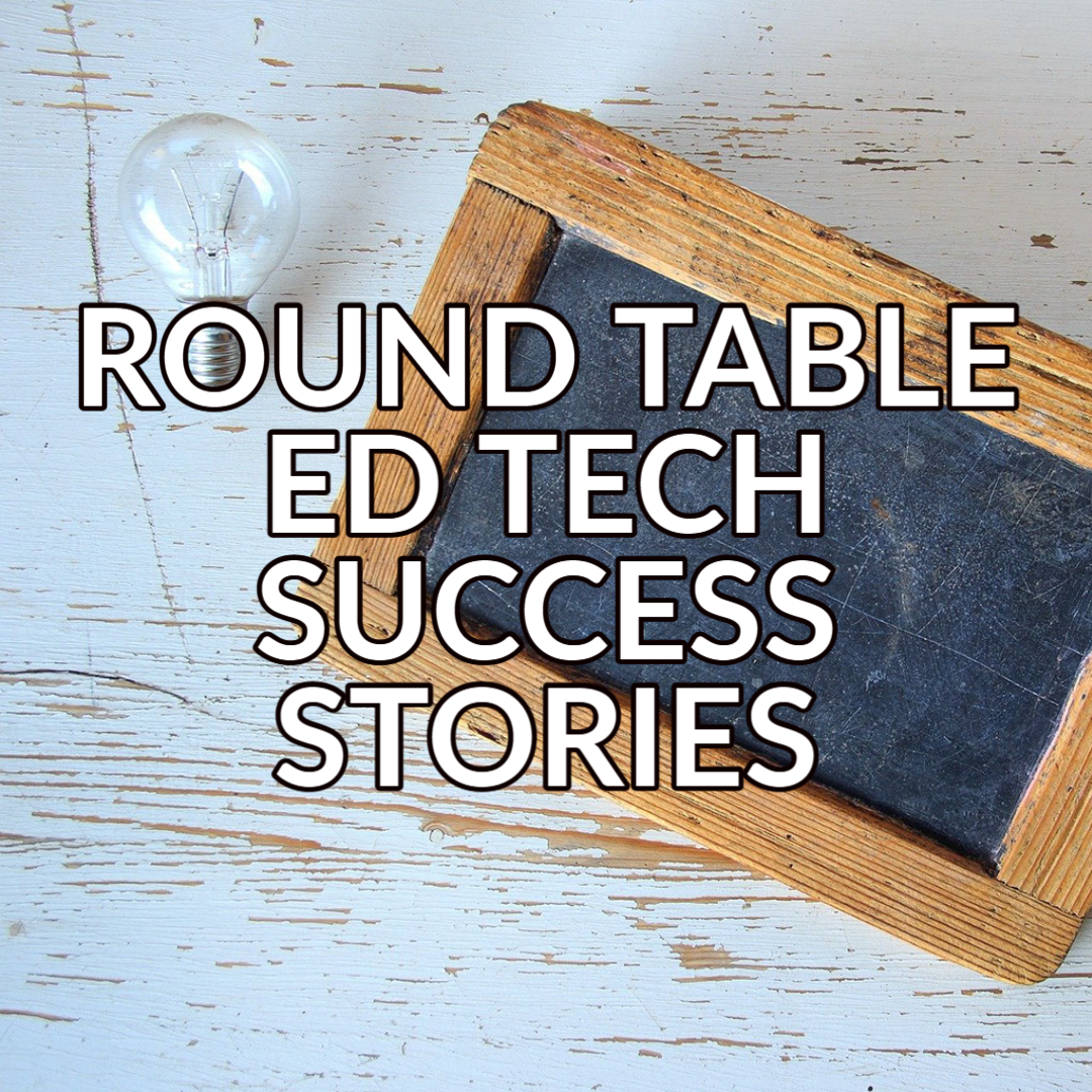 A button that reads "Round Table Ed Tech Success Stories" in white text with a black outline over a background image of a chalkboard and a lightbulb on a light colored table